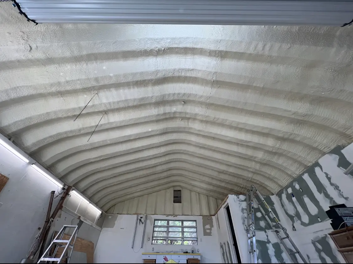Spray polyurethane foam applied to the underside of a metal roof deck in Bryn Mawr-Skyway